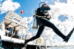Scuba diver preparing with diving equipment
