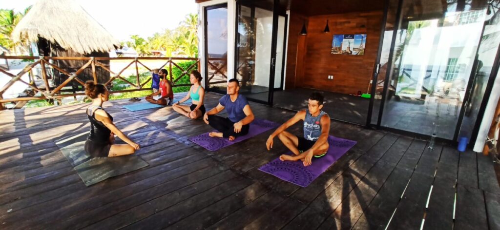 Group Yoga Class By the Sea in Puerto Morelos
